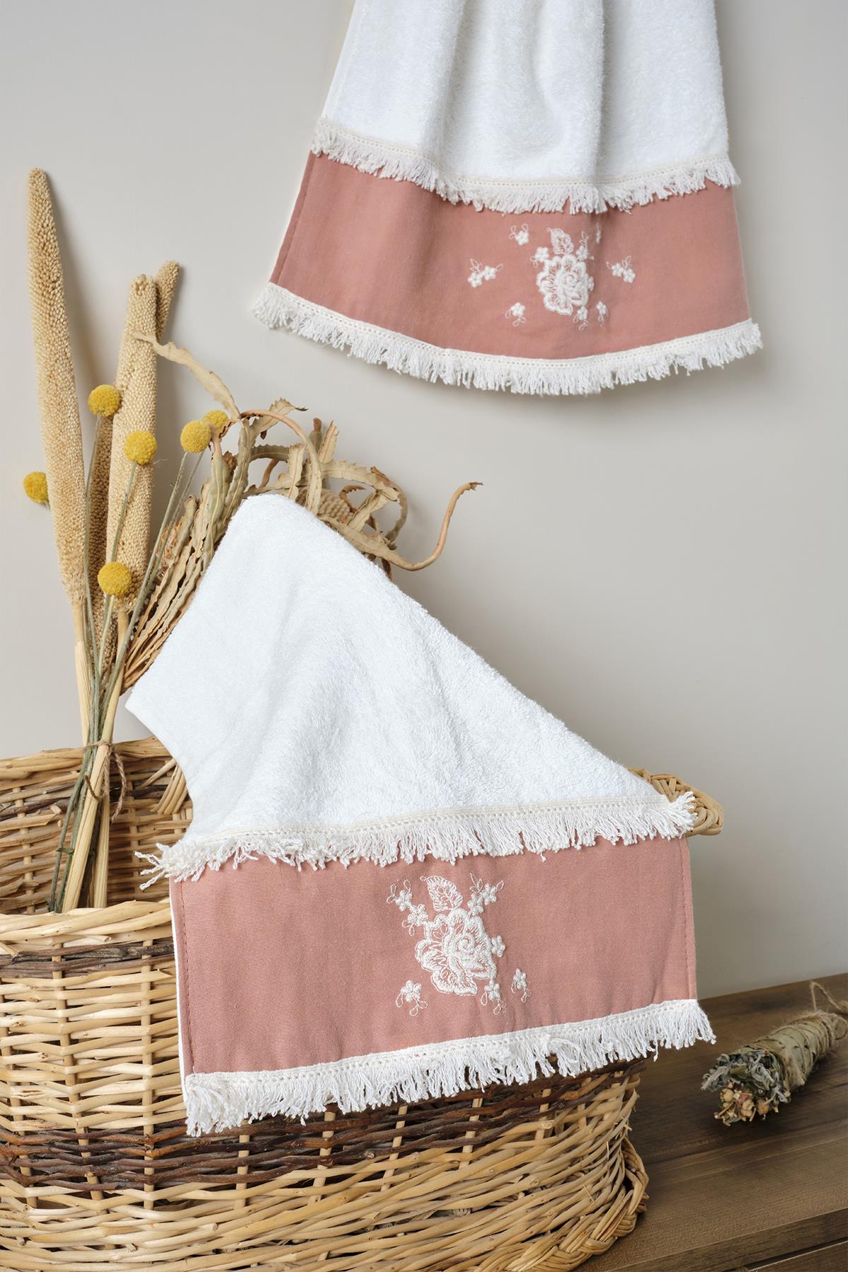 Small powder-colored cotton towel with lace, embroidery, and decorative edges