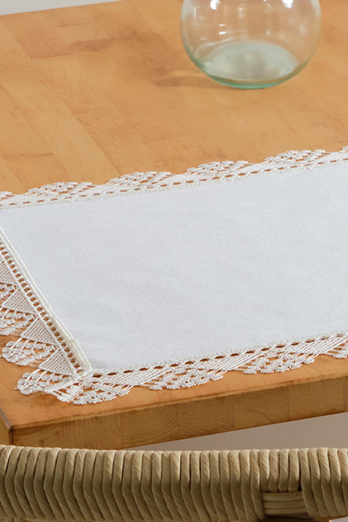 white lace placemat, elegant tablecloth on a wooden table